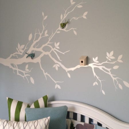 White tree branches on bedroom wall